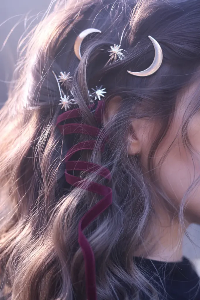 celestial moon and star hair accessories on medium witchy hair
