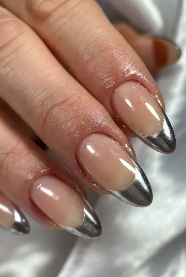 Chrome French tip nails with a sheer nude base for a modern summer French manicure in 2026.