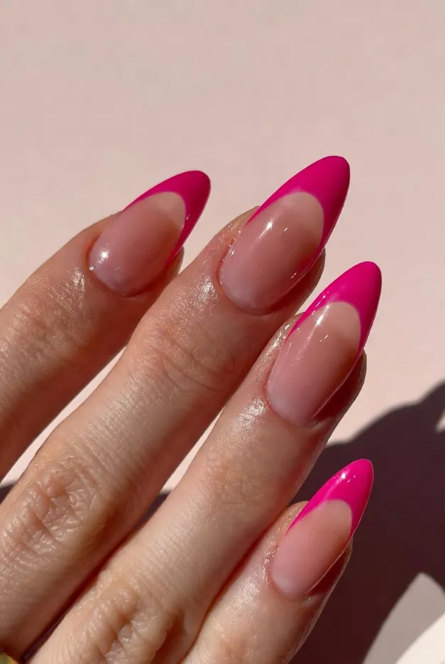 Pink ombre French tip nails with almond shape and glossy jelly finish for summer French tip nails 2026.