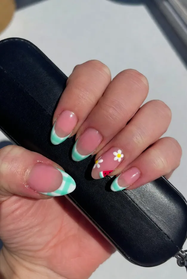 Green gingham French tip nails with tiny summer fruit and flower accents for a playful 2026 manicure.