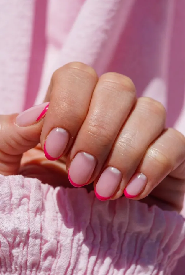Short hot pink micro French tip nails with a glossy sheer pink base, perfect for simple summer French tip nails 2026.