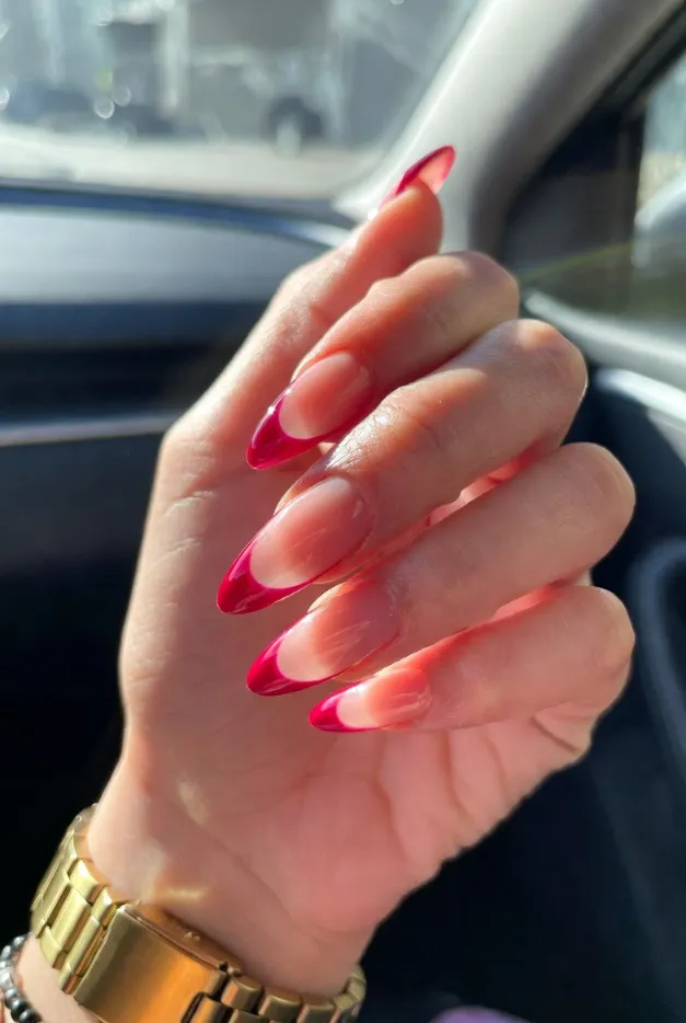 Glossy red jelly French tip nails with almond shape and sheer pink base for summer French tip nails 2026.