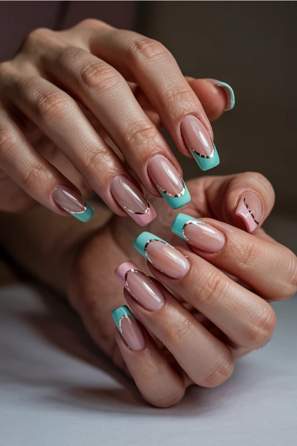 Pastel French tip summer acrylic nails 2026 with metallic line details on almond nails.