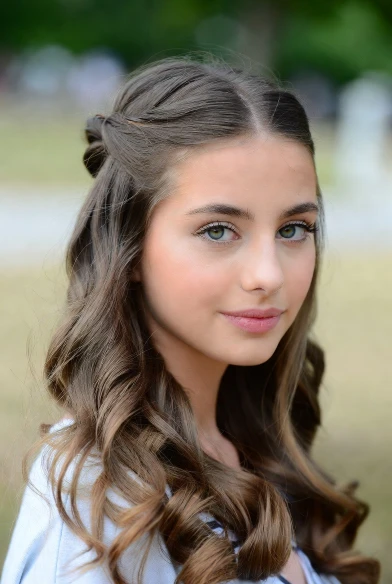 Casual half-up, half-down hairstyle.