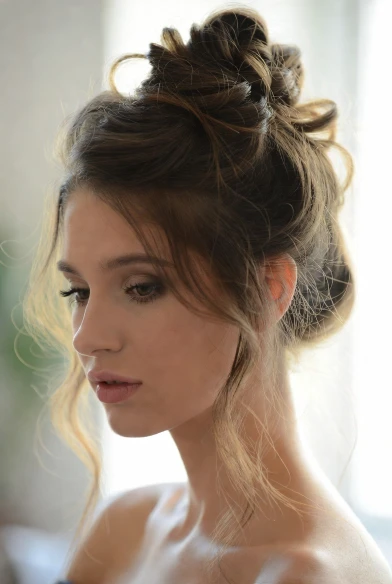 Messy French twist hairstyle for casual elegance.