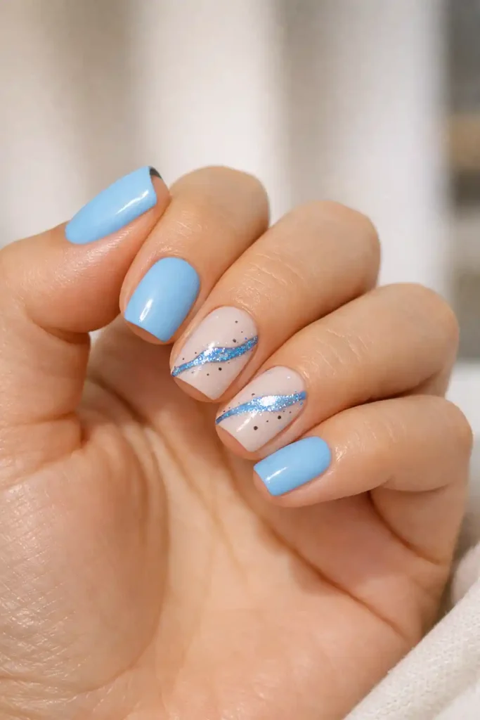 Powder blue Summer Dip Nails 2026 with abstract blue glitter line art