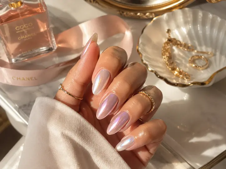 Pastel June nails with lavender, yellow, blue, peach, and floral accent designs.