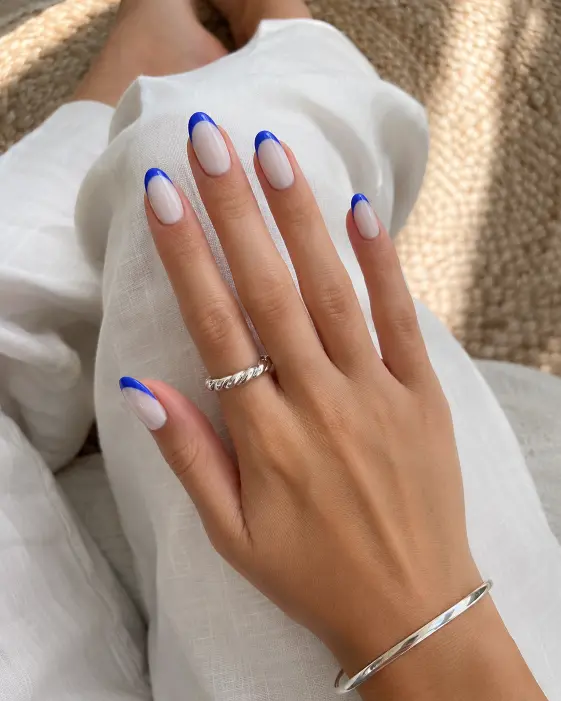 Cool Blue Tip Milky Oval Nails